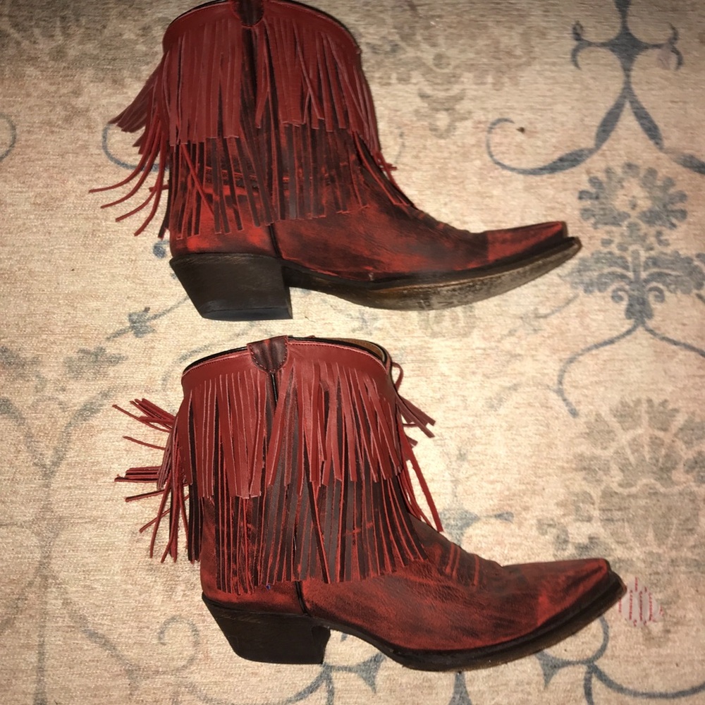 Fringed red cowboy booties.